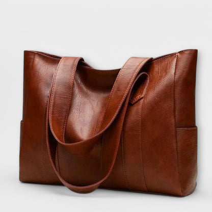 Eteria Vintage Ledertasche in Braun mit praktischem Reißverschluss, ideal für stilbewusste Frauen.